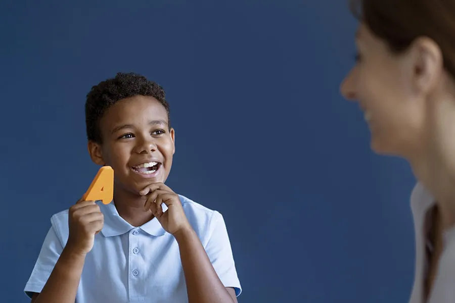 boy-having-occupational-therapy-session-with-psychologist-min